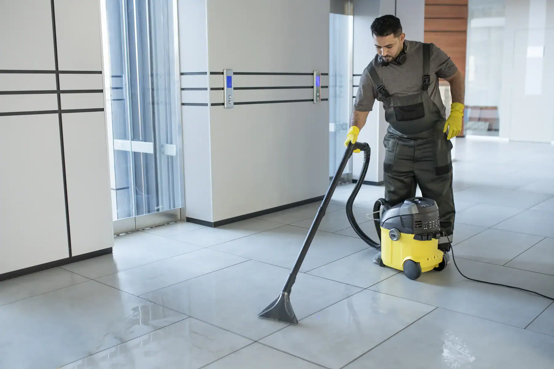 Professional floor cleaning using DNA Cleaning Solution in a modern building.